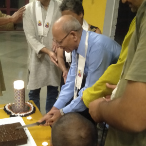 Dh. Adityabodhi cutting cake