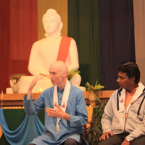 Dh Vidyaruchi addressing youth and translated by Dh. Yashosagar