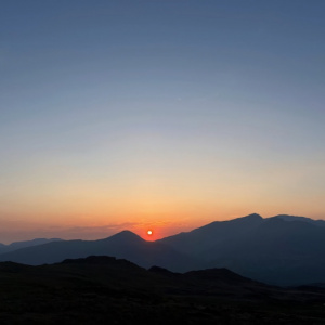 Bivvying alone at 600m, watching the sun set over Snowdon and a crescent moon rise