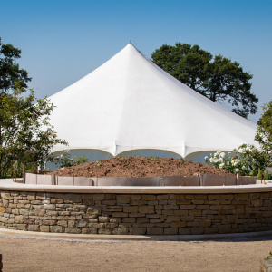 Bhante's burial mound, with the shrine marquee in the background. Photo: Jeremy Peters