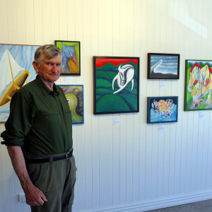 David Litchfield with his paintings 