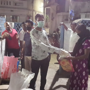 Distributing kits to needy