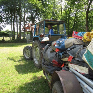 Ross the tractor king pulls in the first batch of tents on site, up from the temporary barn store