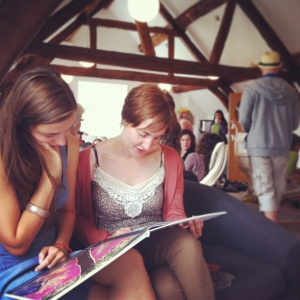 Friends looking at an art catalogue